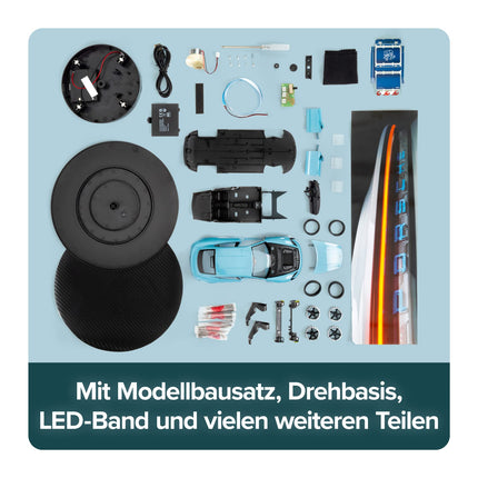 FRANZIS 67203 - Porsche Taycan Advent Calendar Frozen Blue, metal model kit in 1:24 scale, including LED showroom lighting and 52-page accompanying book