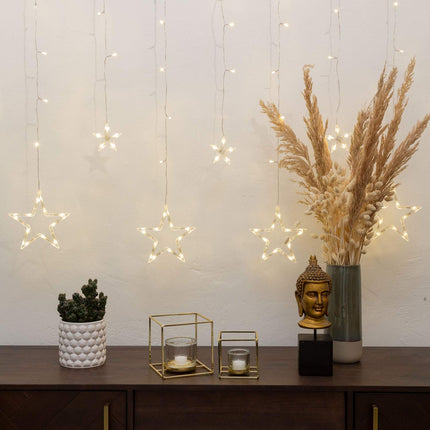 Idena 31485 - LED-valguskardin 138 sooja valge LED-iga, 8-tunnise taimerifunktsiooni ja trafoga, 12 tähekujulise juhtmega, mõõtmetega umbes 2 x 1 m, meisterdamiseks, peokaunistuseks, jõulukaunistuseks, pulmadeks