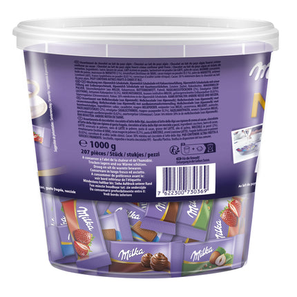 Milka Naps Mix 1 x 1kg purk, õrnalt sulavad minišokolaaditahvlid Alpide piimast, maasikast, sarapuupähklist ja kakaokreemist.