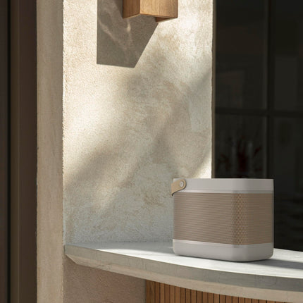 Bang &amp; Olufsen Beolit ​​20 - Powerful, loud, wireless, portable Bluetooth home speaker with 360-degree sound and integrated Qi charging station - Grey Mist