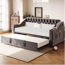 Polsterdatud diivanvoodi, 90/180 x 190 cm, laiemad ja paksemad käetoed USB-laadimispordiga, integreeritud riiul käetugede sees, hoiutaskutega, lamellraamiga, sametkangas, tumehall